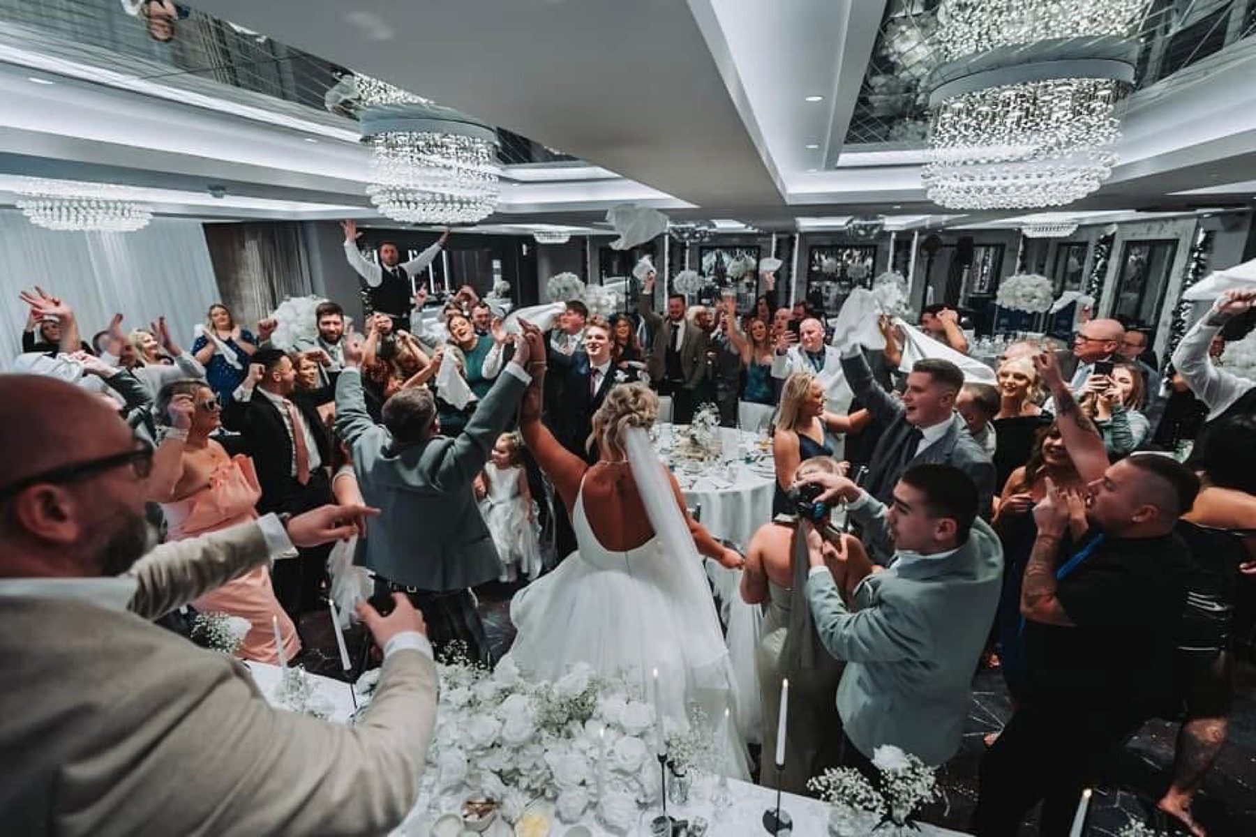 Guests waving napkins during Meal till Midnight